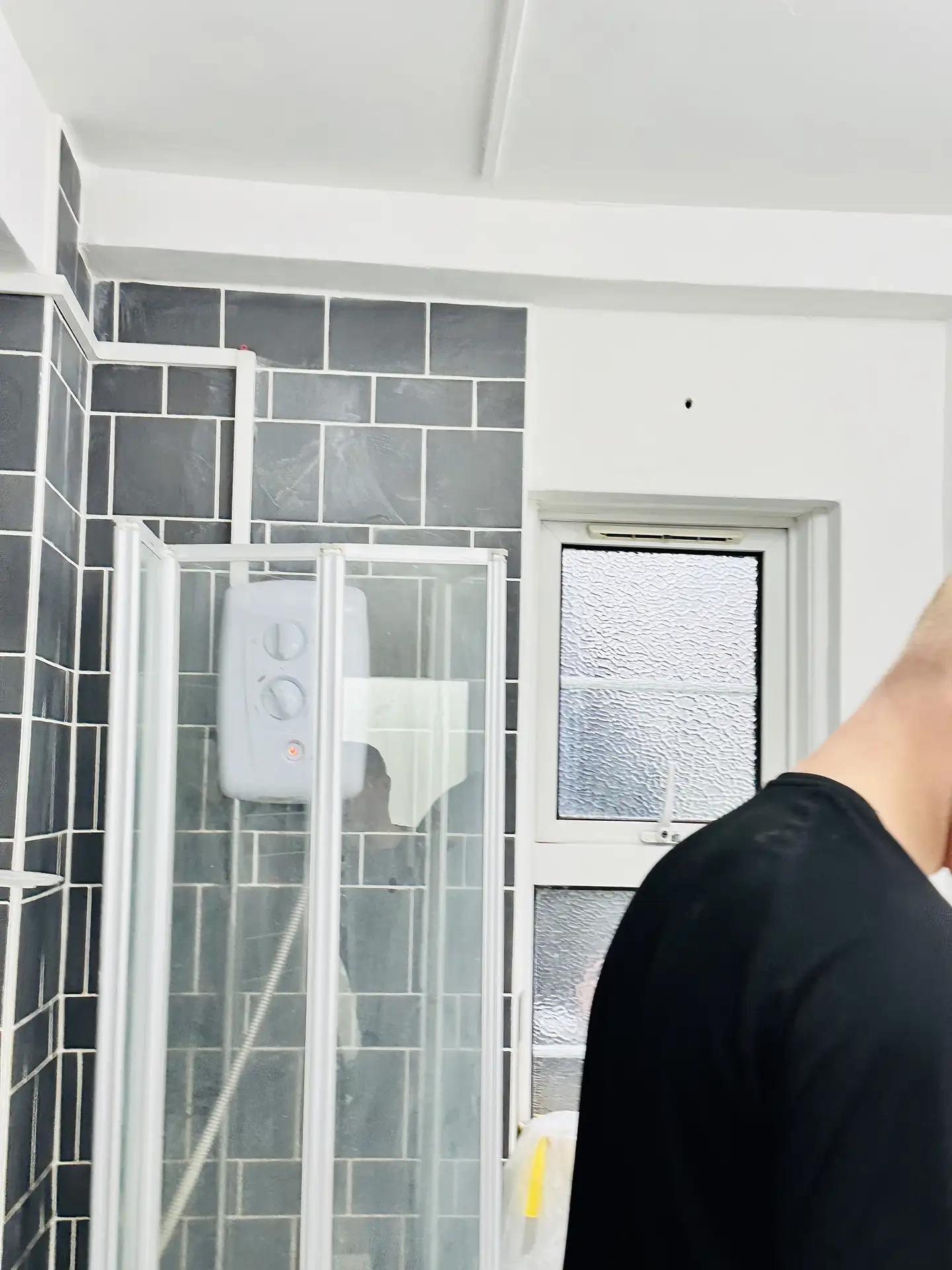 Client Request: Drilling a hole in the bathroom wall